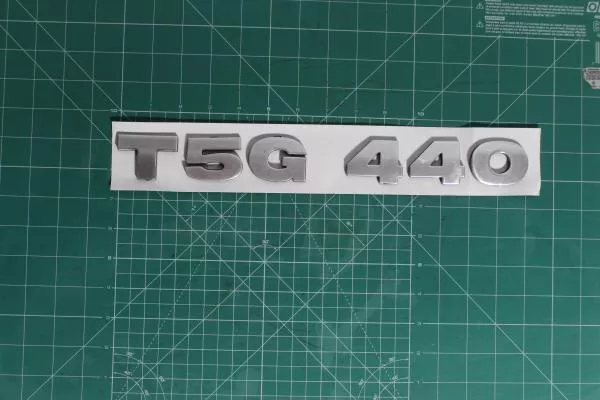 Эмблема (Серый, Пластик) SITRAK, T5G