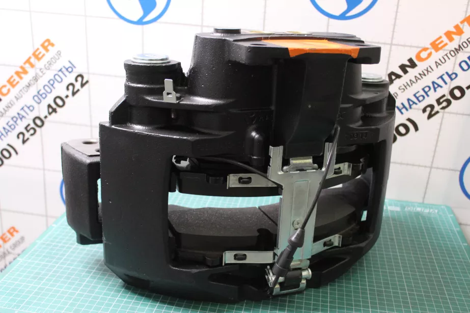 Суппорт тормозной (FR) SHAANXI, X6000 для грузовиков *